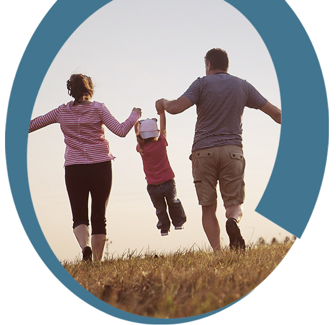 Parents swinging a child in the air