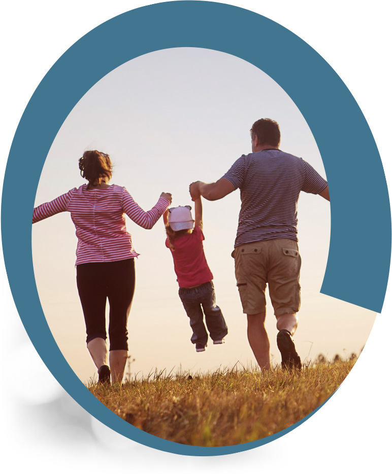 Parents swinging a child in the air