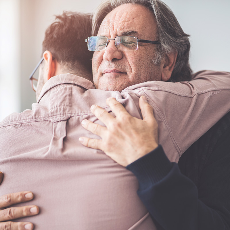 Father hugging his son